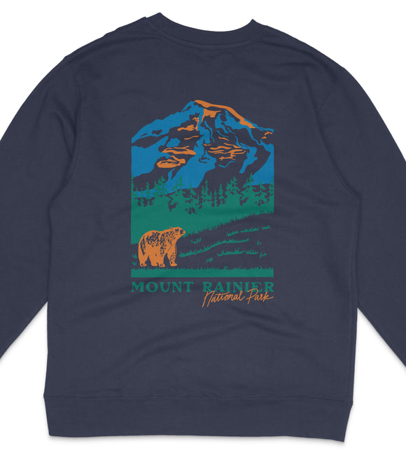 A dark blue sweatshirt with a graphic design depicting a mountain landscape with a bear in the foreground.