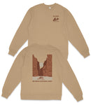 a beige sweatshirt with a graphic design depicting a canyon or valley, along with text that reads "Big Bend National Park".
