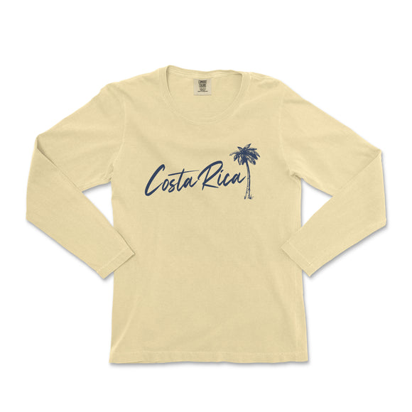 a women's long sleeve shirt with a palm tree on the front