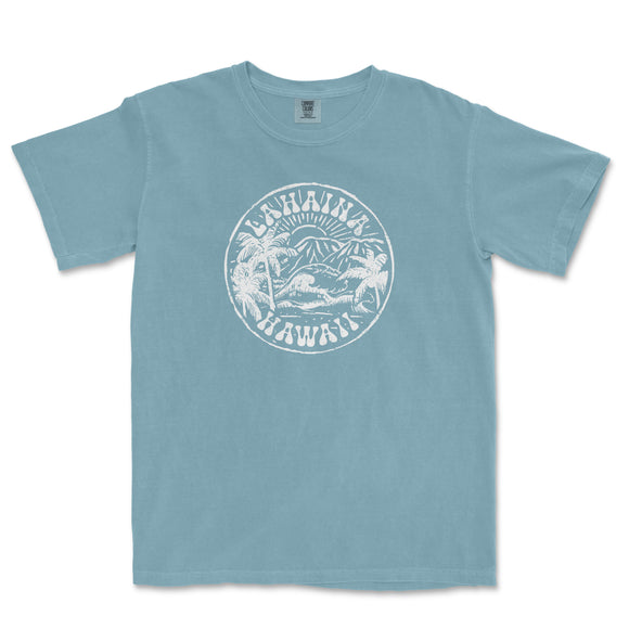 a blue t - shirt with a white print of a beach scene