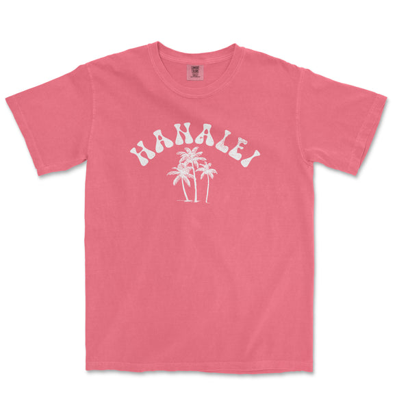 a pink t - shirt with a palm tree on it