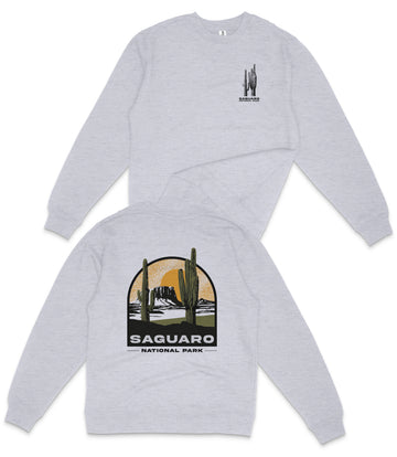 A grey sweatshirt with a graphic design depicting a desert landscape and the text "Saguaro National Park" printed on the back.