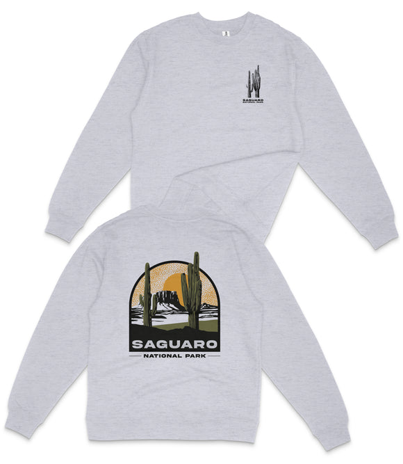 A grey sweatshirt with a graphic design depicting a desert landscape and the text "Saguaro National Park" printed on the back.