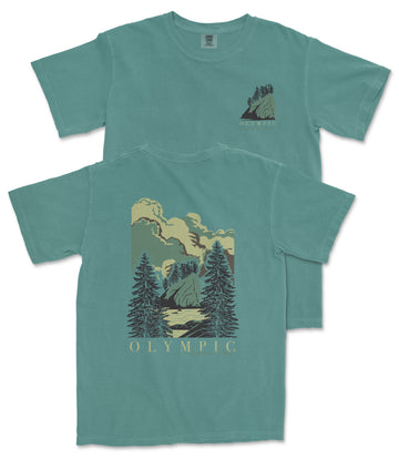 A teal-colored t-shirt with a graphic design depicting a mountain landscape with pine trees and clouds.