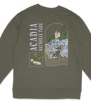 A grey sweatshirt with a graphic design featuring a bird, a lighthouse, and a mountain landscape.