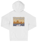 A white hooded sweatshirt with a graphic design depicting a scenic landscape with mountains and water.
