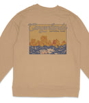 a beige sweatshirt with a graphic design depicting a scenic landscape with mountains and a body of water.