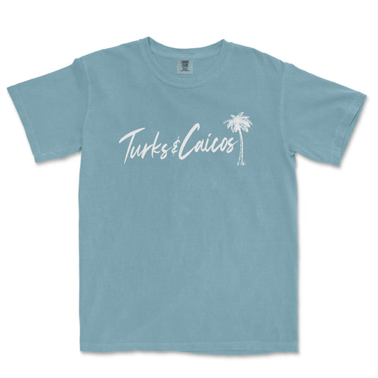 a blue t - shirt with the words tukes calicos written in white