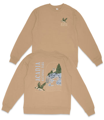 a tan sweatshirt with a graphic design on the back, depicting a bird and a landscape with trees.