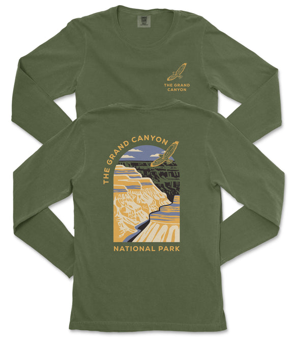 a green long-sleeved t-shirt with a graphic design depicting the Grand Canyon.