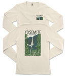 A white long-sleeved t-shirt with a graphic design depicting a waterfall and mountains, along with the text "Yosemite National Park" printed on it.