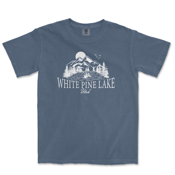 a blue t - shirt with white pine lake on it