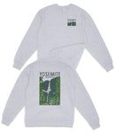 A gray sweatshirt with a graphic design on the back depicting a mountain range and the text "YOSEMITE" printed on it.