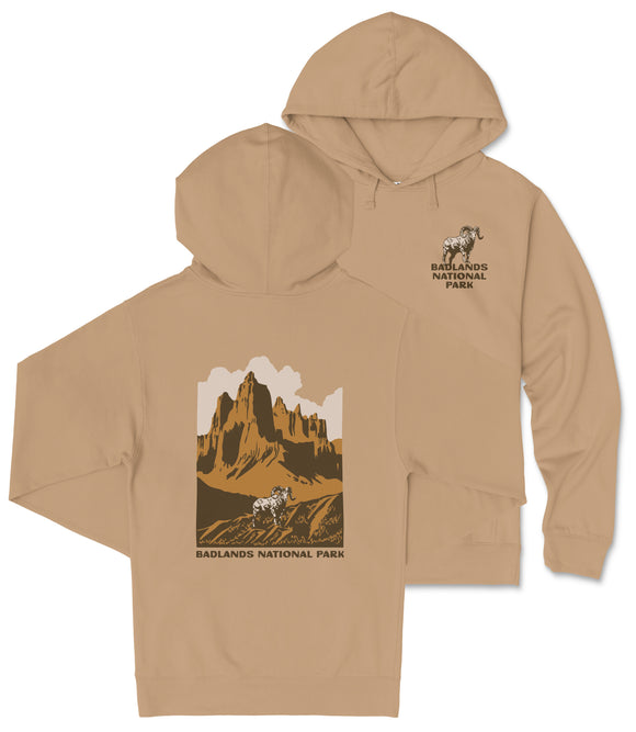 A tan hooded sweatshirt with a graphic design depicting a mountain landscape and the text "Badlands National Park" printed on the back.