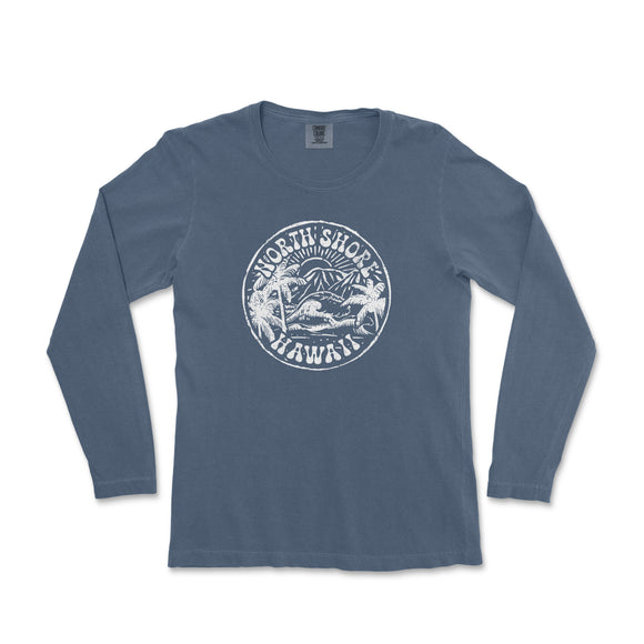 a blue long - sleeved shirt with a mountain scene on it