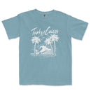 a blue t - shirt with a picture of a wave and palm trees