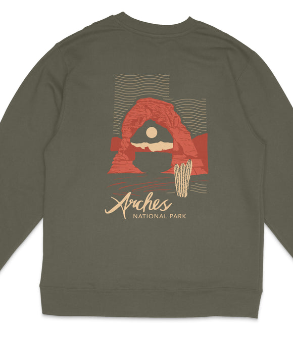 A gray sweatshirt with a graphic design featuring a desert landscape with a rock formation and a cactus.