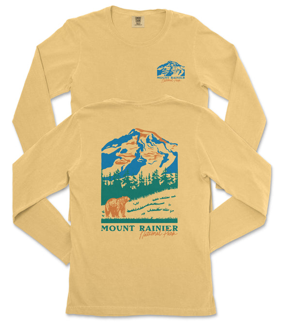 A yellow long-sleeved t-shirt with a graphic design depicting a mountain landscape and a bear.