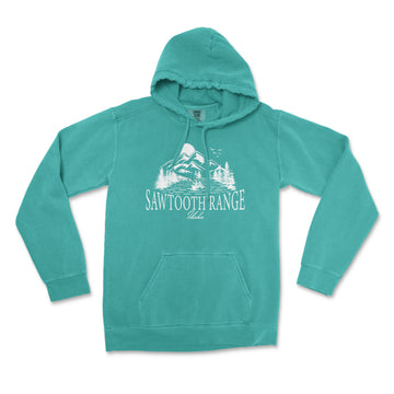 a green sweatshirt with a picture of a mountain