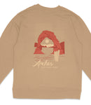 A beige sweatshirt with a graphic design depicting a red arch and desert landscape, along with the text "Arches National Park".