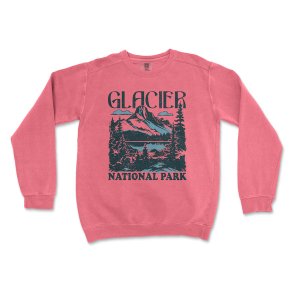 a pink sweater with a picture of a mountain