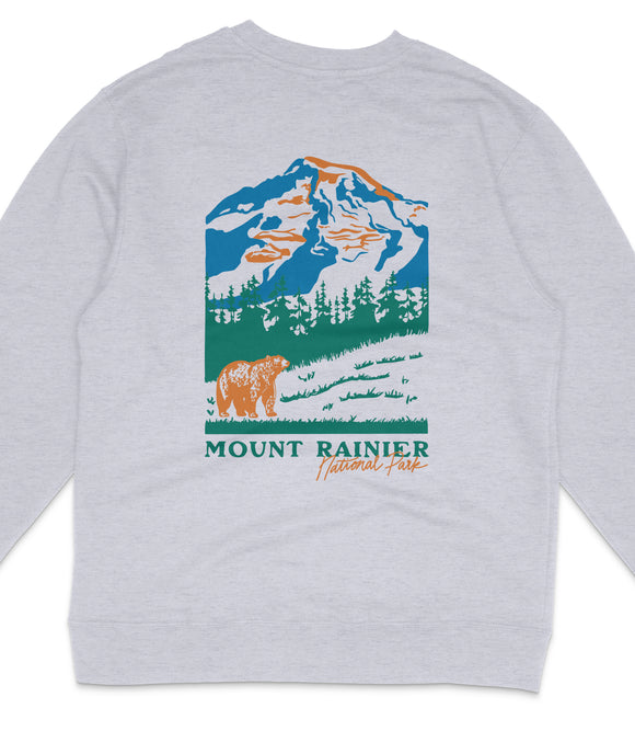 A gray sweatshirt with a graphic design depicting a mountain landscape with a bear in the foreground.