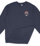 A navy blue long-sleeved shirt with a circular logo on the left side.