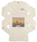 A white long-sleeved t-shirt with a graphic design depicting a scenic landscape, including mountains and a body of water.