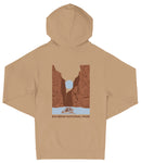 A beige hooded sweatshirt with a graphic design depicting a canyon landscape and a boat on a river.