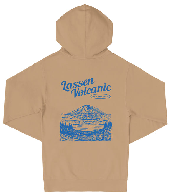 A beige hooded sweatshirt with a graphic design depicting a mountain landscape and the text "Lassen Volcanic National Park" printed on the back.