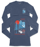 a long-sleeved blue t-shirt with a graphic design featuring a mountain range, a tree, and a sun. The design includes text that reads "BANFF NATIONAL PARK".