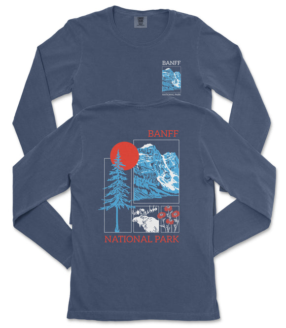 a long-sleeved blue t-shirt with a graphic design featuring a mountain range, a tree, and a sun. The design includes text that reads "BANFF NATIONAL PARK".
