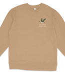 A tan long-sleeved shirt with a graphic of a bird and the text "ACADIA NATIONAL PARK" printed on the front.