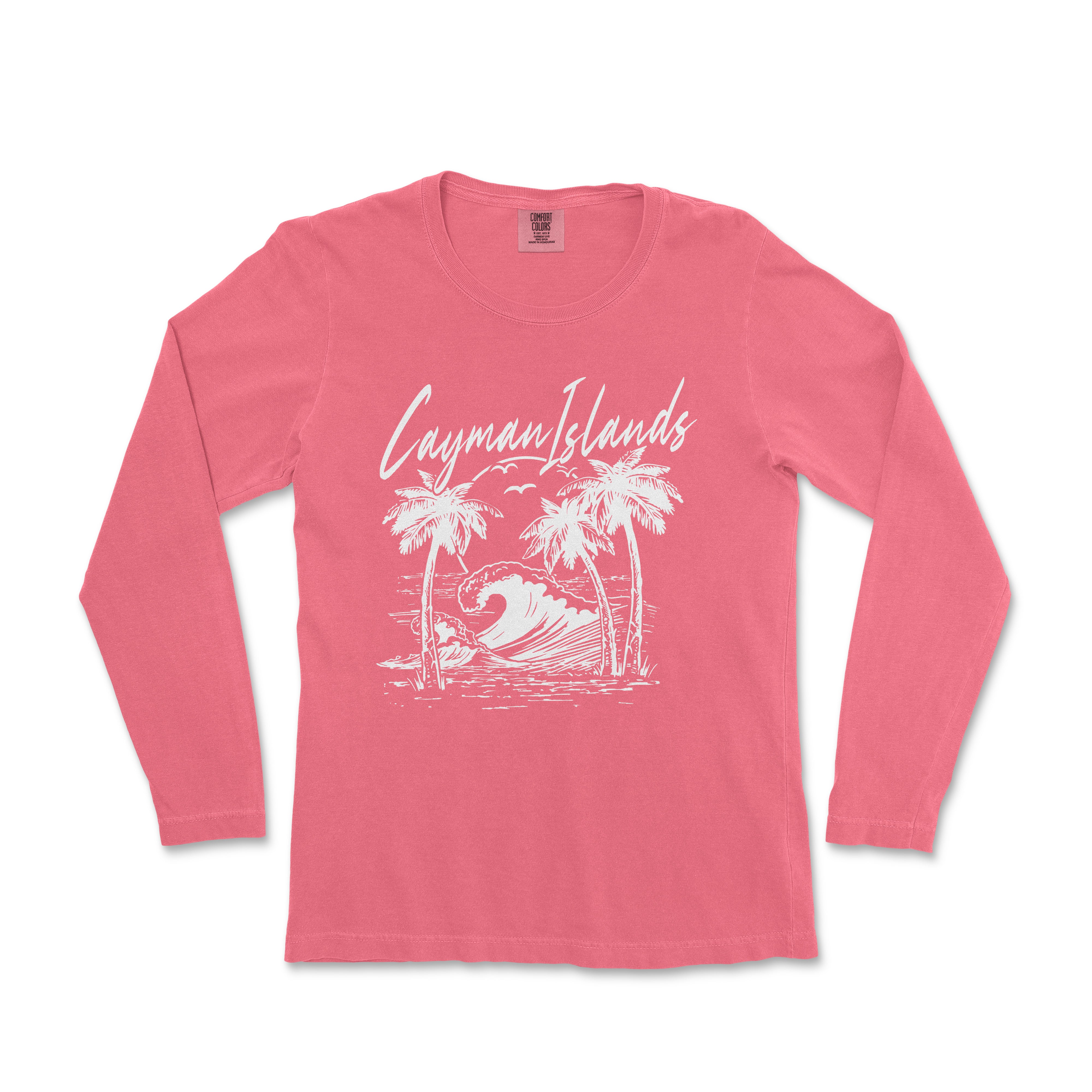a women's long sleeve shirt with a graphic of a surfboarder riding