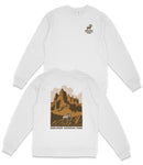 a white long-sleeved shirt with a graphic design depicting a mountain landscape and a horse. The design includes the text "BADLAND'S NATIONAL PARK" printed on the back of the shirt.