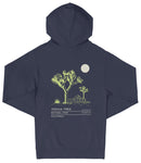 A navy blue hooded sweatshirt with a graphic design depicting a desert landscape with a tree and a moon.