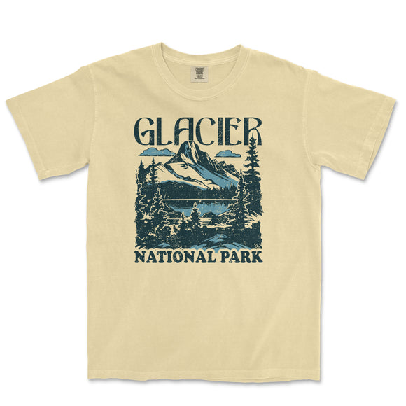 a yellow t - shirt with a picture of a mountain and lake