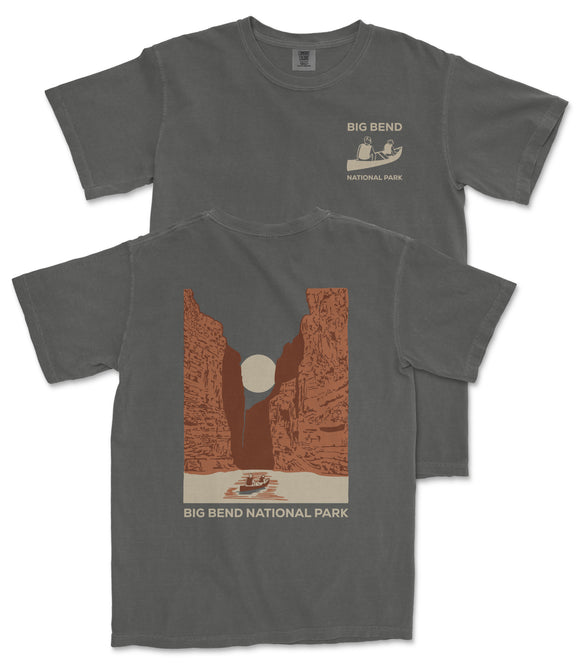 a gray t-shirt with a graphic design depicting a canyon landscape with a boat on a river. The text on the t-shirt reads "BIG BEND NATIONAL PARK" and "BIG BEND".