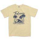 a yellow t - shirt with a picture of a wave and palm trees