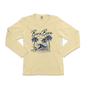 a women's long sleeve shirt with a picture of a surfer on the beach