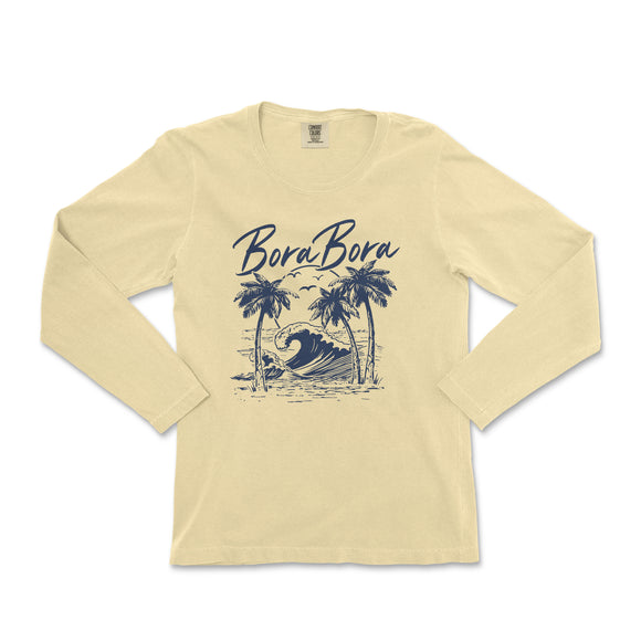 a women's long sleeve shirt with a picture of a surfer on the beach