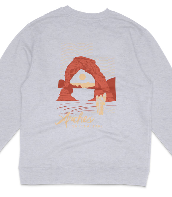 A gray sweatshirt with a graphic design depicting a natural landscape, including a large arch formation and a sunset.