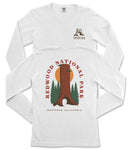 a white long-sleeved t-shirt with a graphic design depicting a redwood tree and the text "REDWOOD NATIONAL PARK NORTHERN CALIFORNIA".