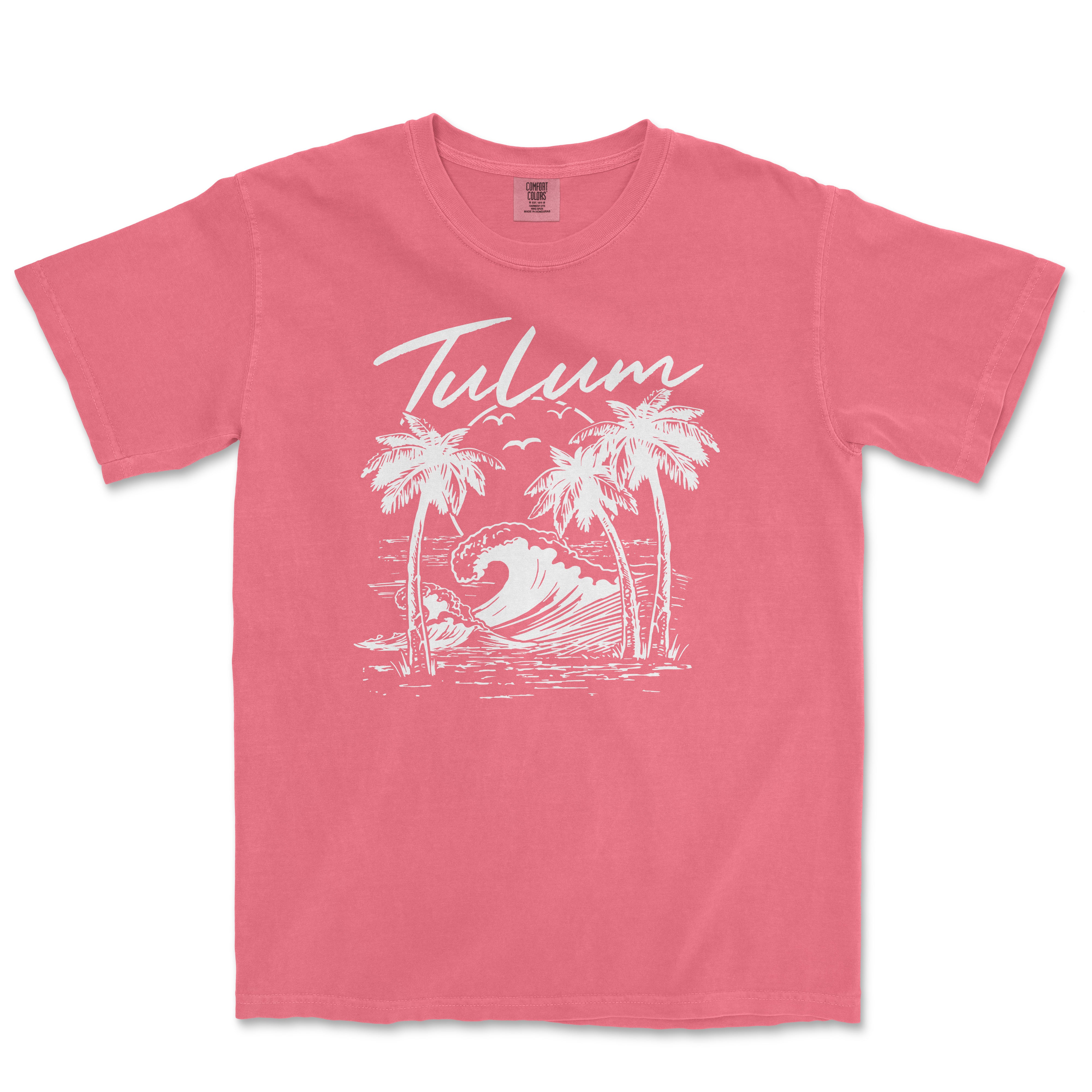 a pink t - shirt with a palm tree and a wave