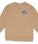 A tan long-sleeved shirt with a blue graphic design on the left side.