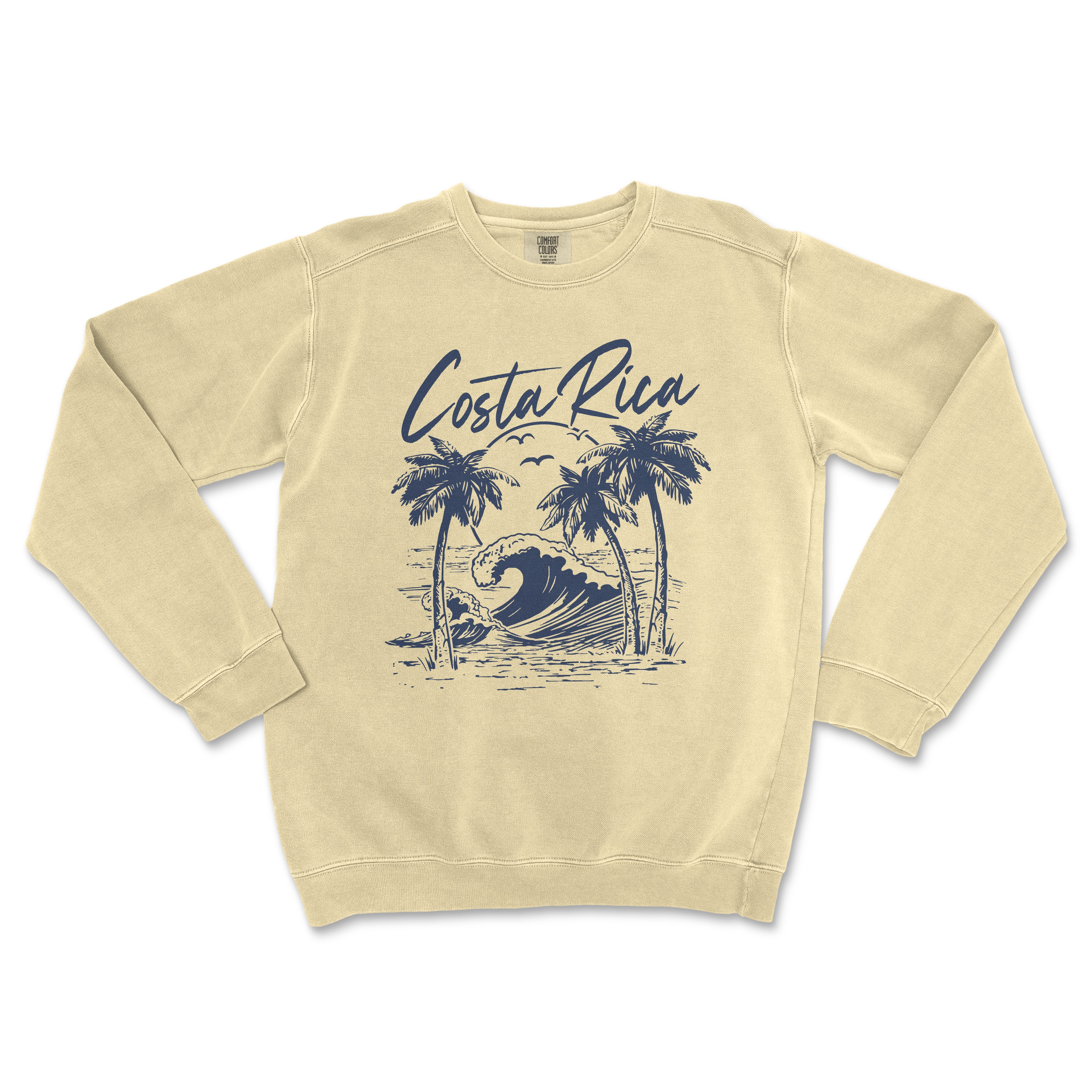 a white sweatshirt with a blue graphic of a wave and palm trees