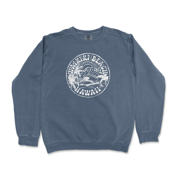 a blue sweatshirt with a white seal on it
