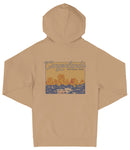 A beige hooded sweatshirt with a graphic design depicting a scenic landscape with mountains and water.