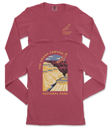 a red long-sleeved t-shirt with a graphic design depicting the Grand Canyon.