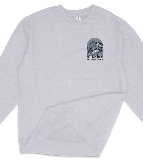 A gray long-sleeved shirt with a graphic design on the front, depicting a building and the text "GLACIER NATIONAL PARK".